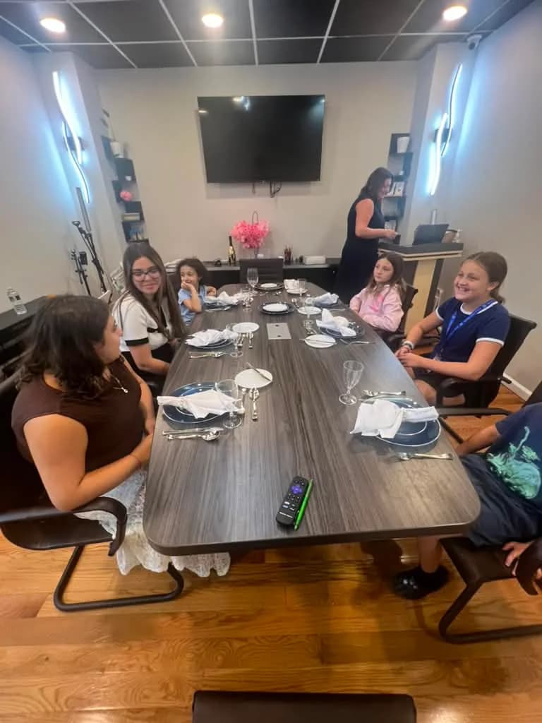 Students seated together during an etiquette class